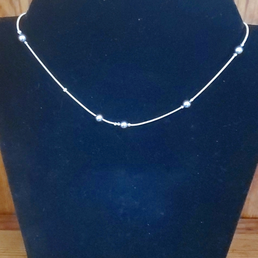 Metallic bead and silver tone chain